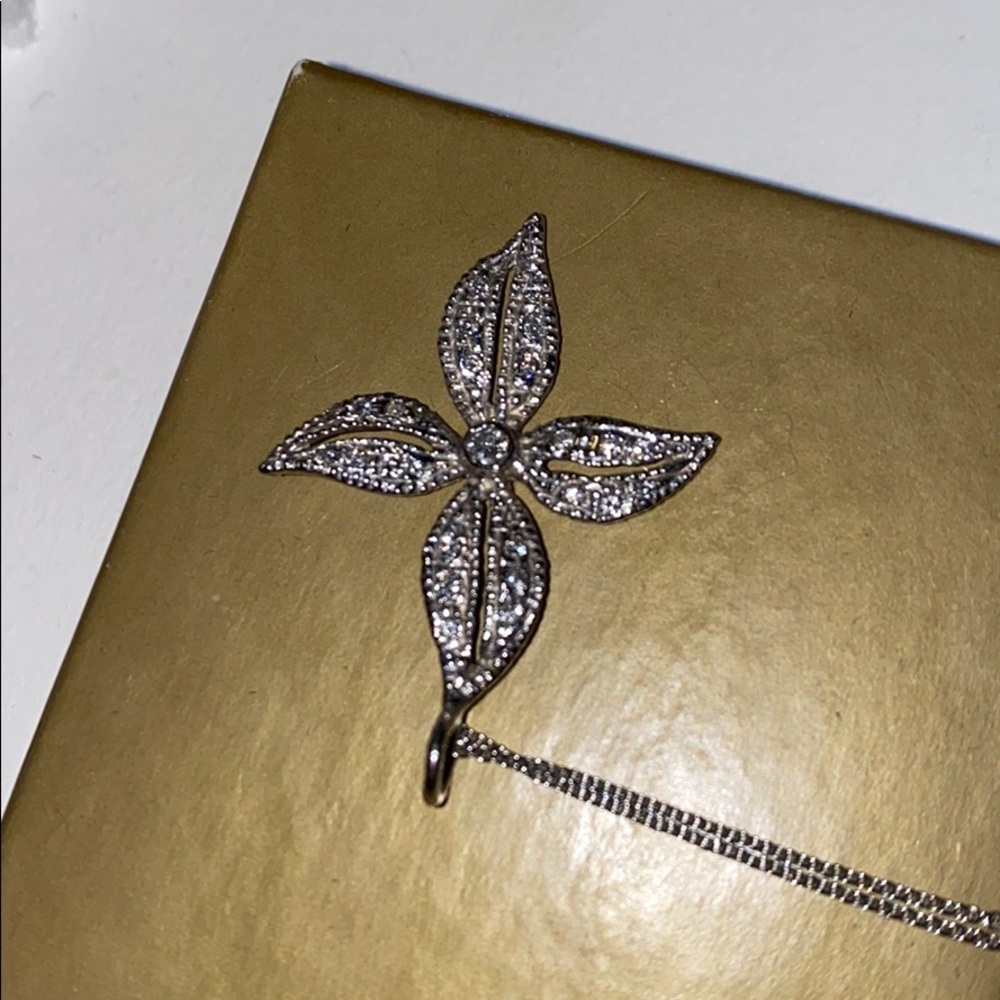 Platinum and diamond flower neckace